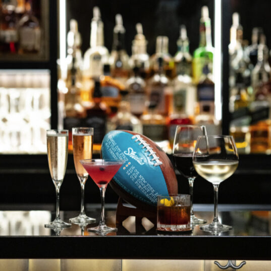 a shulas football and several cocktails on the restaurant bar